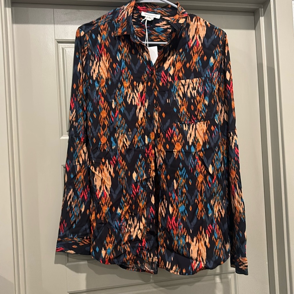 Women’s button up blouse from beach lunch lounge